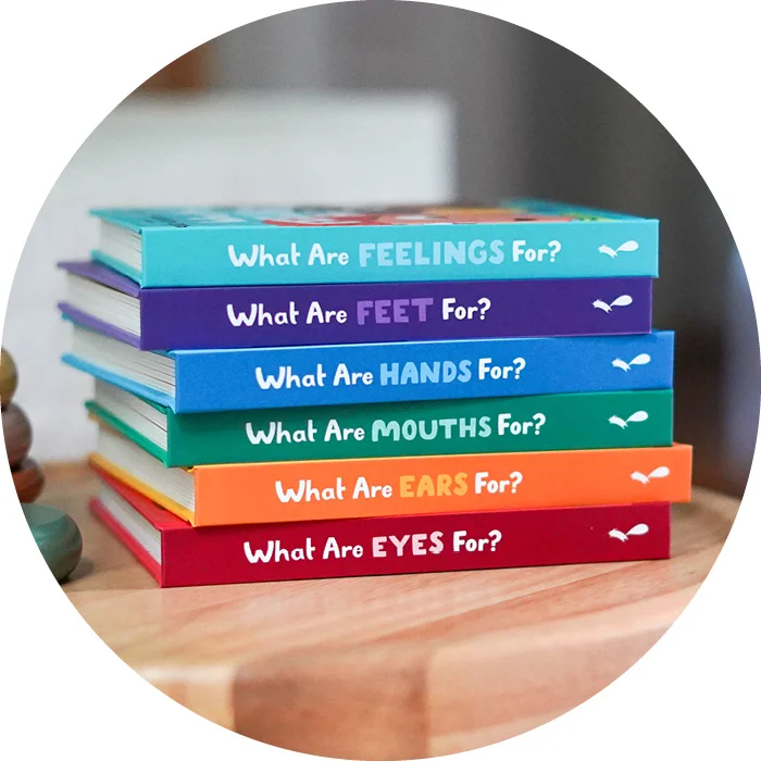 A stack of board books from the Training Young Hearts Series