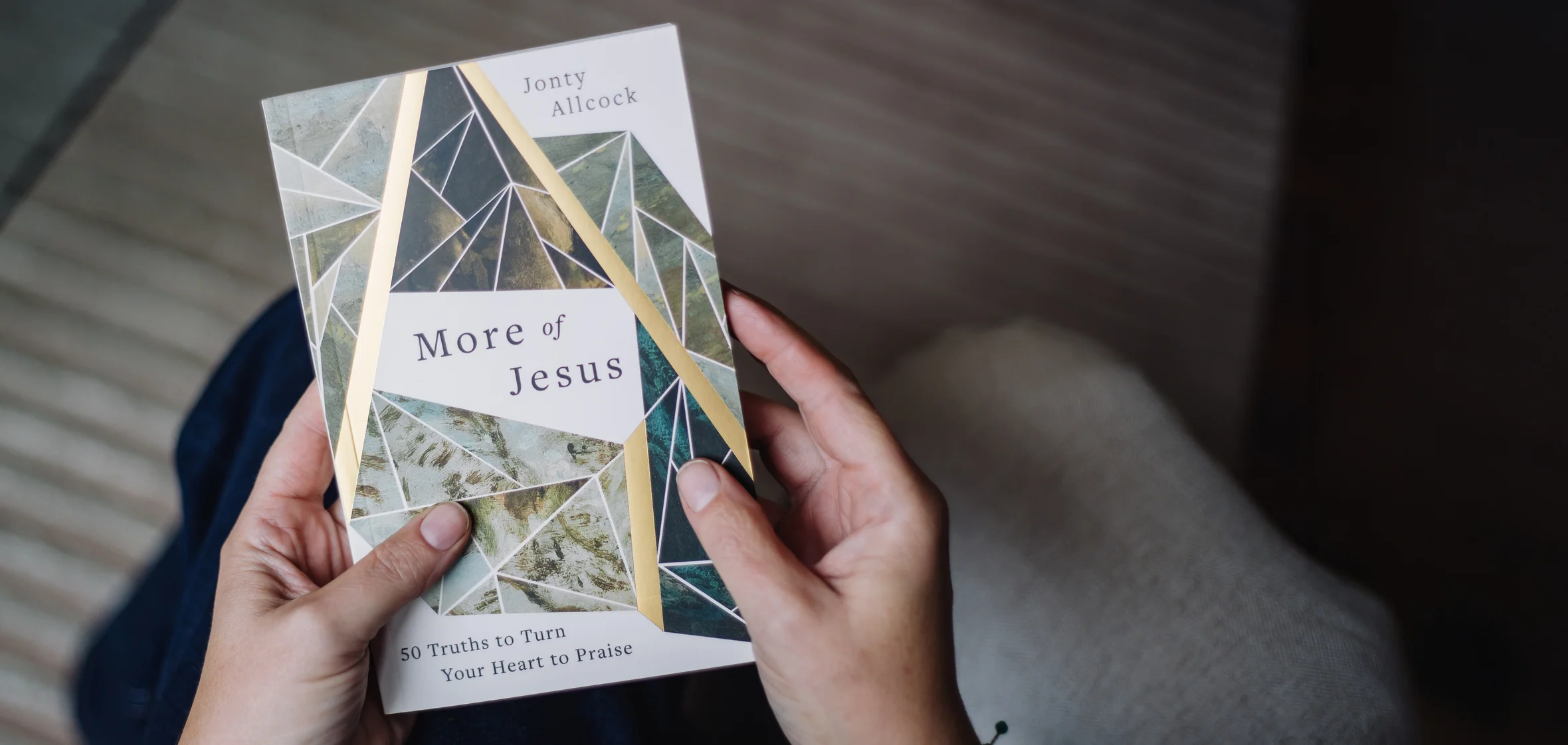 Photograph of someone holding More of Jesus devotional
