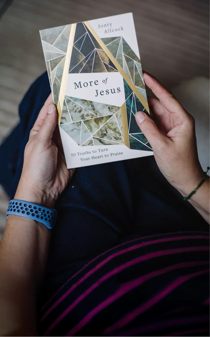 Photograph of someone holding More of Jesus devotional