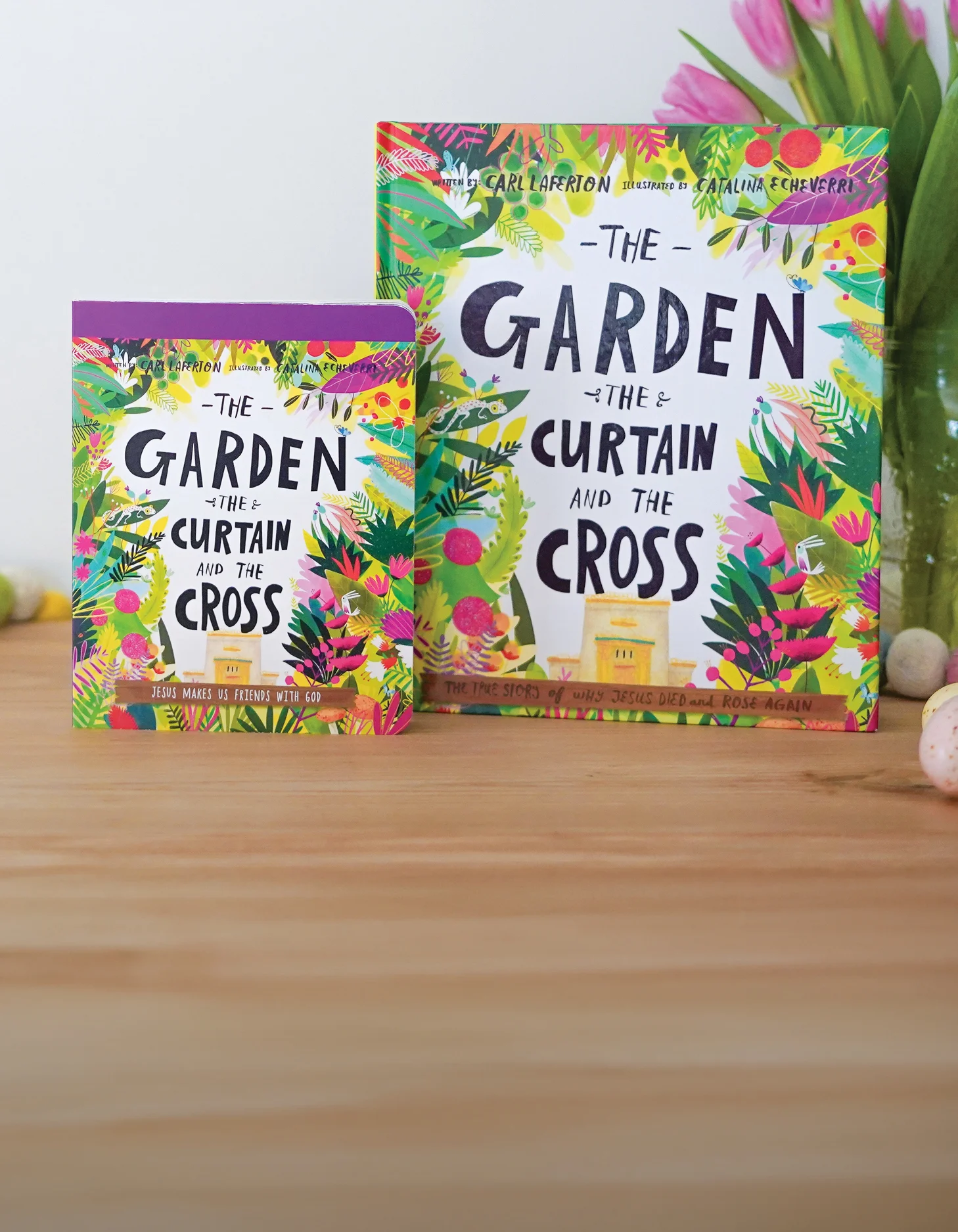 Photograph of The Garden The Curtain and the Cross board book and storybook propped up on a wooden surface